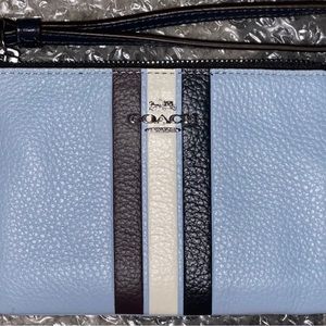 Coach Wristlet. 6.25 x 4.25. Light blue base with dark blue and white stripe.